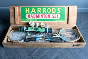 1950's complete Badminton Set including rackets, shuttlecocks and net finished in a wooden box with stamping specifically for Harrods.