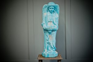 Religious angel with over sized wings holy water font covered in a stunning blue glaze on top of ceramic to give it a crackle effect with natural weathering.