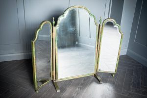 A stunning vanity mirror with three sections all complete with mirror finished in a green wash along with a hand painted subtle floral design edging.
